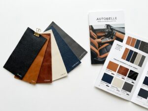 Multiple automotive leather color swatches fanned out with interior color palette
