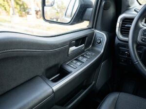 Power window switch and lock button cleanly installed in pickup truck door panel